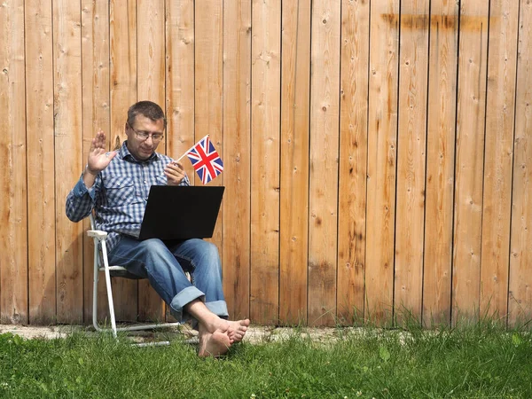 Adult man on a wood background. Pastoral life Concept