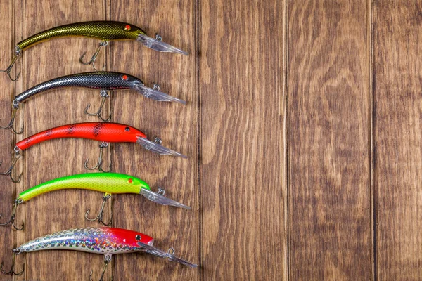 Señuelos Pesca Lado Lado Sobre Fondo Madera —  Fotos de Stock