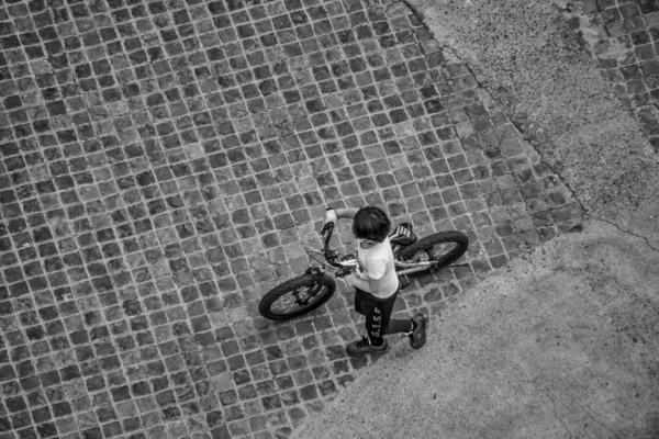 a child walking with cycle