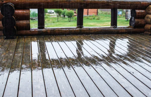 Wooden terrace in the rain