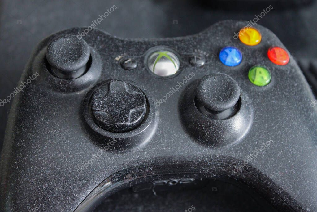 Moscow, Russia, February 2020: Close up of abandoned Xbox game console covered in dust