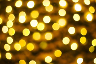 Sarı çelenk ışıklarının bulanık arkaplanı, bokeh. Noel.