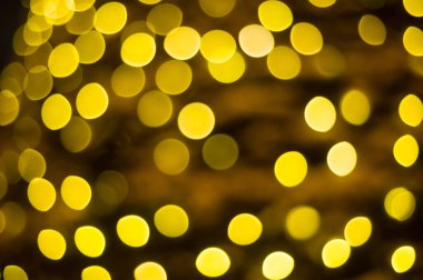 Sarı çelenk ışıklarının bulanık arkaplanı, bokeh. Noel.