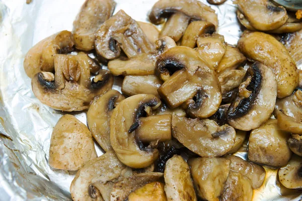 We cook mushrooms in the oven. Baked, close-up.