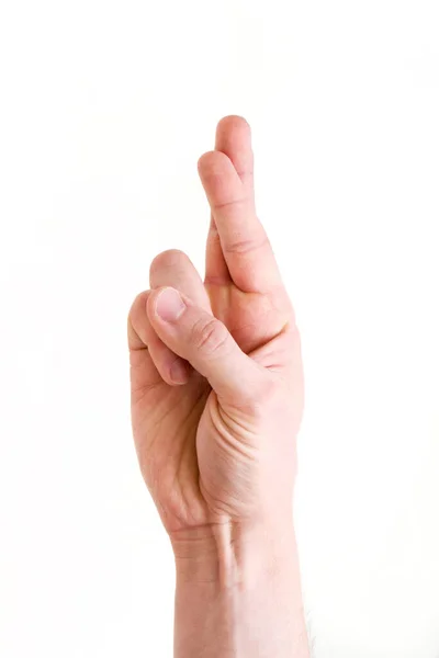 Een mensenhand in het gebaar "gekruiste vingers" betekent succes, geloof, hoop, geluk in het bereiken van het doel — Stockfoto