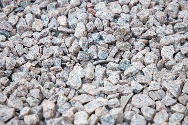 Granit taş desenli arka plan, yakın plan. Küçük çakıllar.