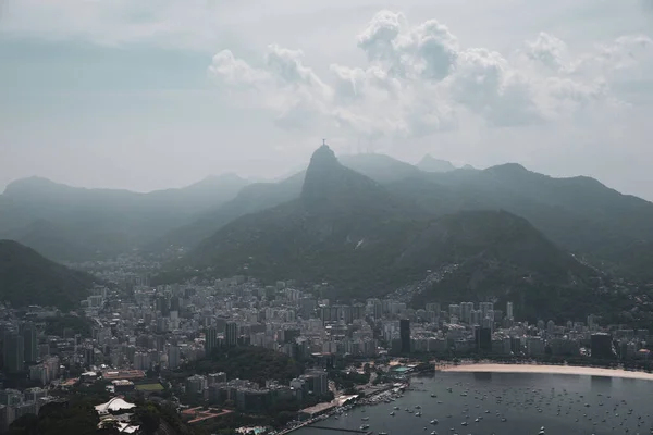 View of the Sugar Loaf in Botafogo, a mountain, and a landscape of Rio de Janeiro from a cable car, Brazil.