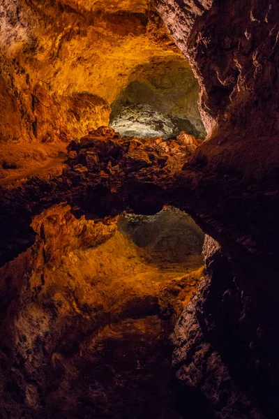 Cueva de los Verdes, Green Cave in Lanzarote. The Canary Islands.  an amazing lava tube and tourist attraction on Lanzarote island, Spain. Multi-colored illumination of caves. Beautiful cave. Stalactites in an old cave.