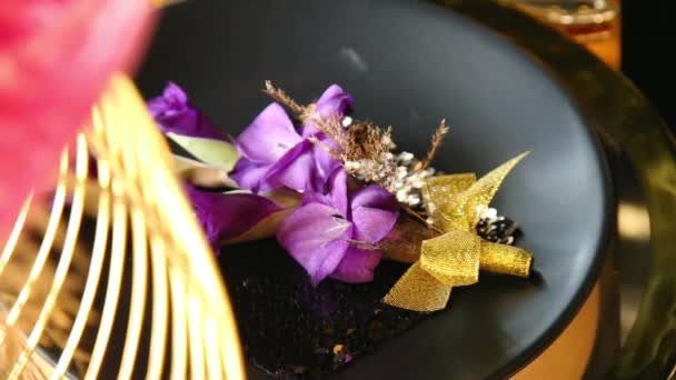 Slow Motion Gold Black Cutlery Lilac Gladiolus Leaves — Stock Video