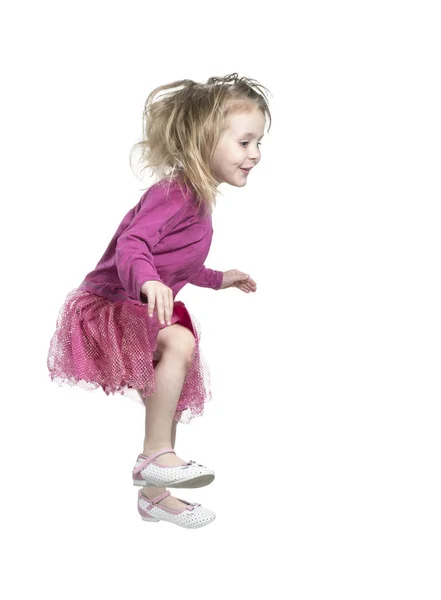 Jumping little girl in a skirt — Stock Photo, Image