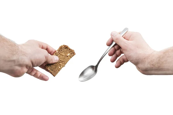 Bread and a spoon in male hands — Stock Photo, Image