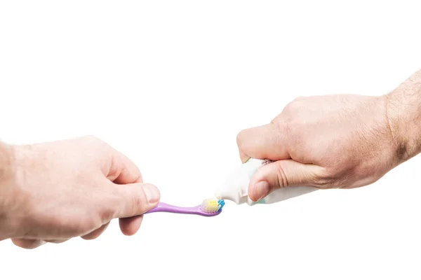 Extrusion of toothpaste on toothbrush — Stock Photo, Image