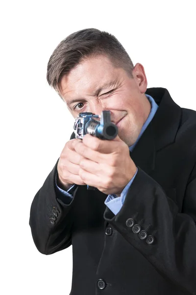 Businessman is aiming with a gun — Stock Photo, Image