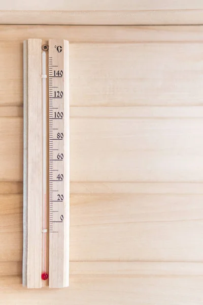 Thermometer on a wooden wall — Stock Photo, Image