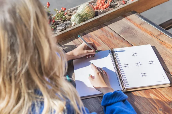 Woman Writes Notebook Her Left Hand View — Stock Photo, Image