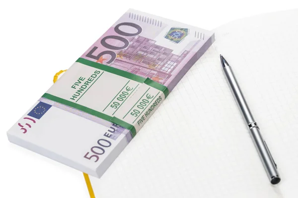 Pen and money on notebook — Stock Photo, Image