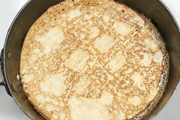 Pancake on old cast iron skillet — Stock Photo, Image