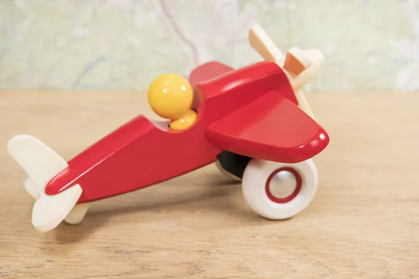 Wooden red plane on the table — Stock Photo, Image