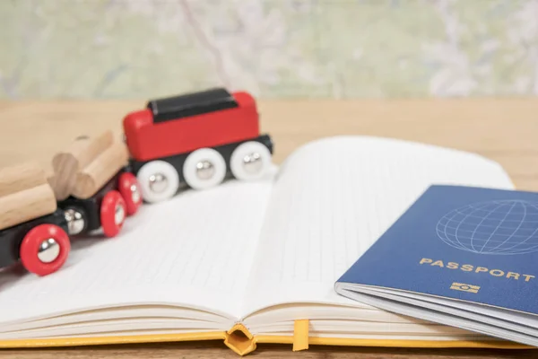 Train and passport on notepad — Stock Photo, Image