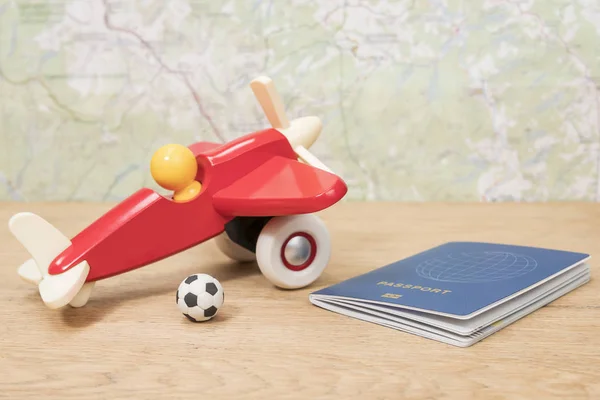 Miniature Soccer Ball Toy Plane Passport Lying Wooden Table Background — Stock Photo, Image
