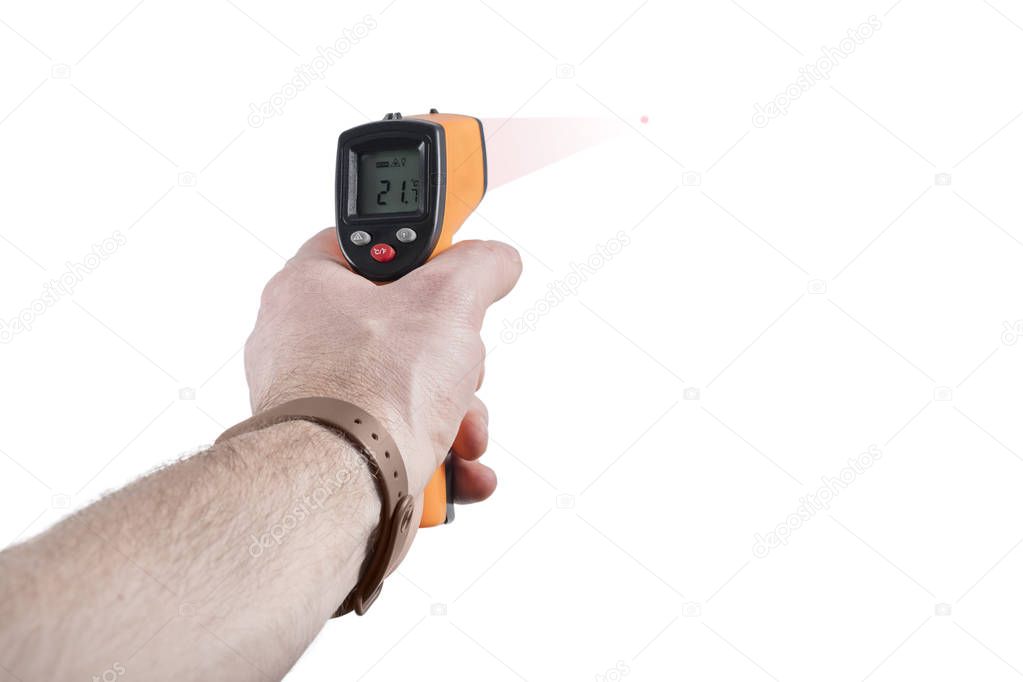 Infrared thermometer in a man hand measures the temperature, isolated on white background