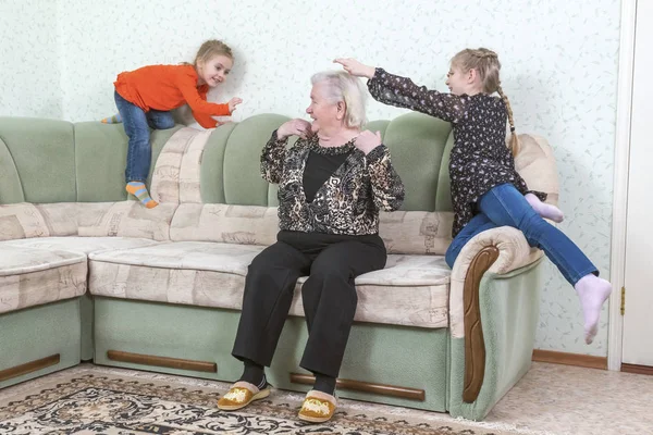 Grandmother playing with granddaughters — Stock Photo, Image