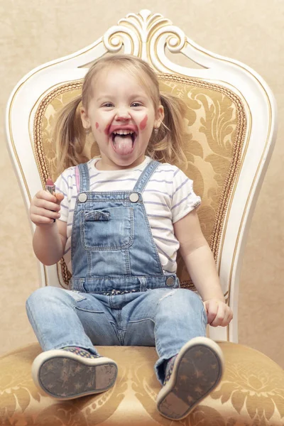 Cheerful child smeared with lipstick — Stock Photo, Image