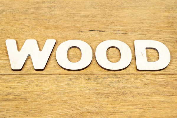 Word hout op een houten tafel — Stockfoto