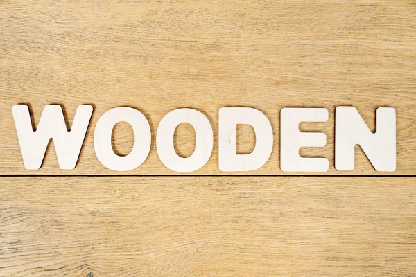 Woord houten op een oude tafel — Stockfoto