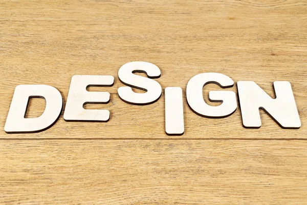 Design de palavras de letras de madeira na mesa — Fotografia de Stock