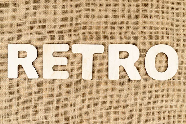 Word retro of wooden letters on canvas — Stock Photo, Image