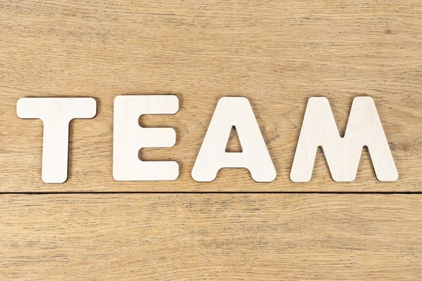 Word team on a wooden table — Stock Photo, Image