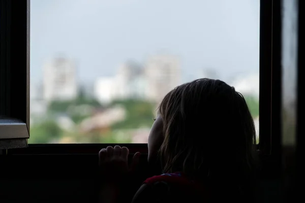 Silhouette Sad Child Leaning Edge Open Window Looking Distance — Stock Photo, Image