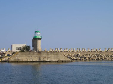 Lighthouse and breakwaters in Port Constanta, Romania clipart