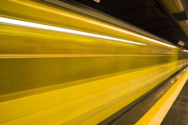 Yellow metro train in motion .Transportation in Naples city, Italy. -