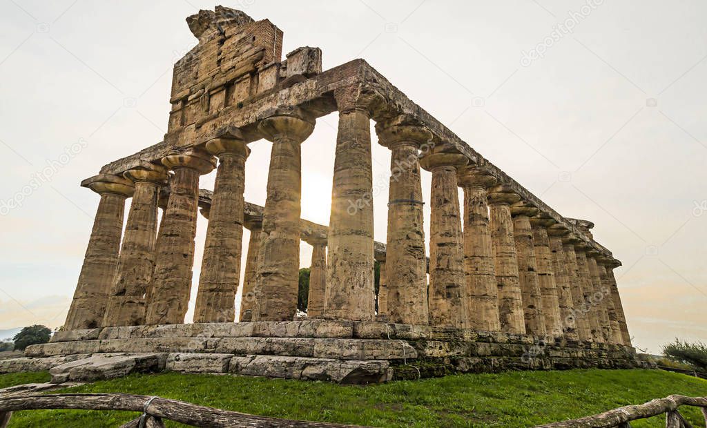 Greek Temples of Paestum - UNESCO World Heritage Site, with some of the most well-preserved ancient Greek temples in the world. It's about three temples of Hera, Poseidon and Ceres in Paestum ,Italy.  Beautiful sunset at background