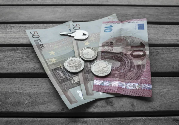 Cash Euro and key for small business deal