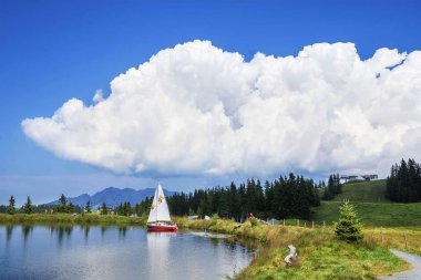 SCHEFFAU, TIROL, AUSTRIA - AUGUST 28, 2016. Hintersteinersee mountain lake, summer wellness attraction in Scheffau am Wilden Kaiser, Tirol, Austria