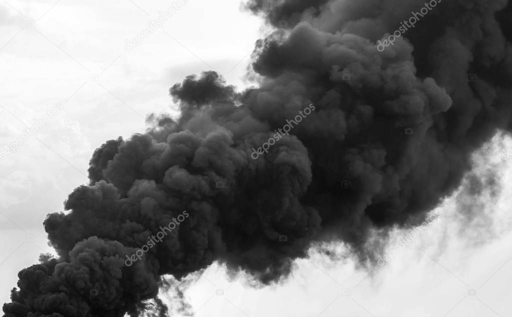 Huge smoke clouds on sky background