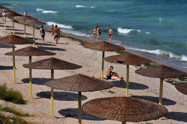 VAMA VECHE,CONSTANTA,ROMANIA-AUGUST 2018.Vama Veche beach,a non-mainstream tourist destination on the Black Sea coast, near the border with Bulgaria,popular destination for tourists from entire world clipart