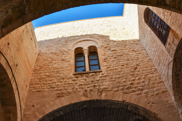 Beautiful ancient walls with blue sky in the Old Town of Bari, Italy