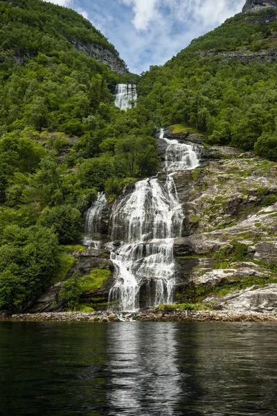 The Seven Sisters unique waterfall at Geirangerfjord seens by boat trip, Sunnmore region, Norway,  most beautiful fjords in the world, included on the UNESCO World Heritage.