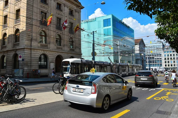 GENEVA, SWITZERLAND  - AUGUST 29 , 2019. Street traffic in the famous center of Geneva. Rue de Rhone street.