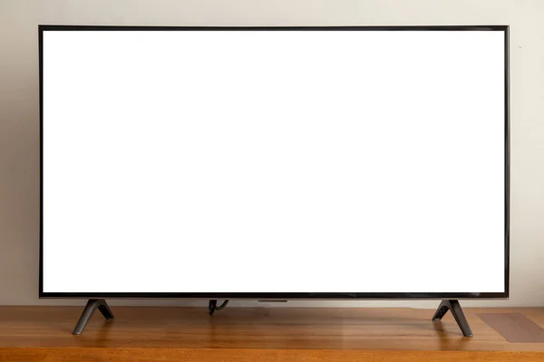 blank screen led television on wood table.