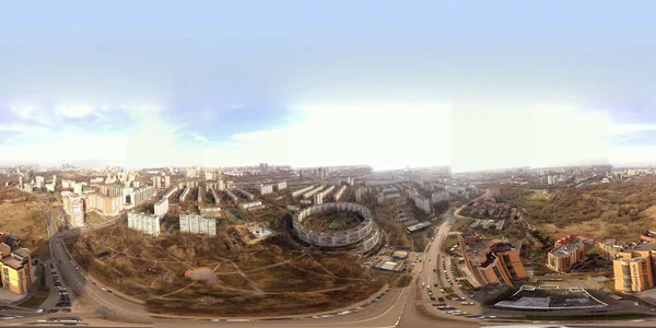 city panoramic view with houses and roads and thunderclouds taken from a quadrocopter