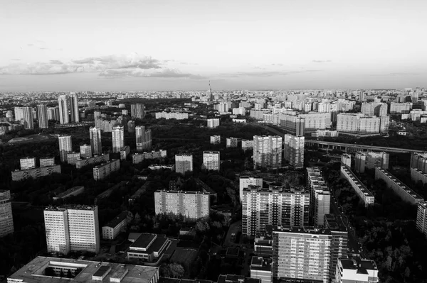 city panoramic view with houses and roads at sunset shot from a quadrocopter