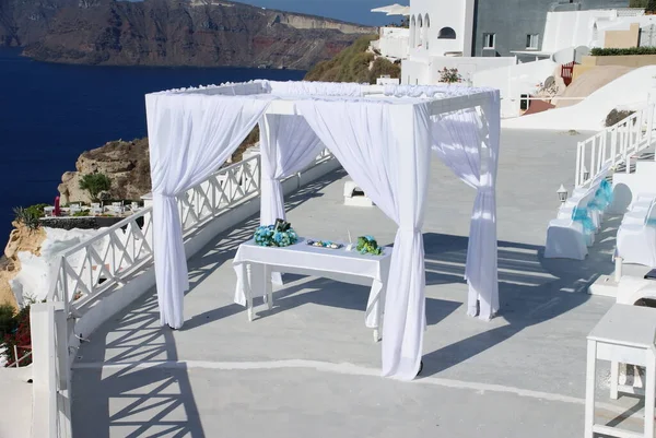 wedding tent on a white veranda against the blue sea on the island of love