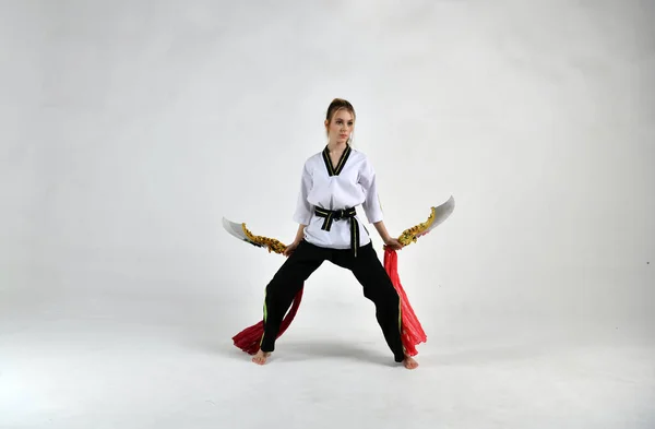 Beautiful Girl White Black Suit Does Exercises Golden Battle Swords — Stock Photo, Image