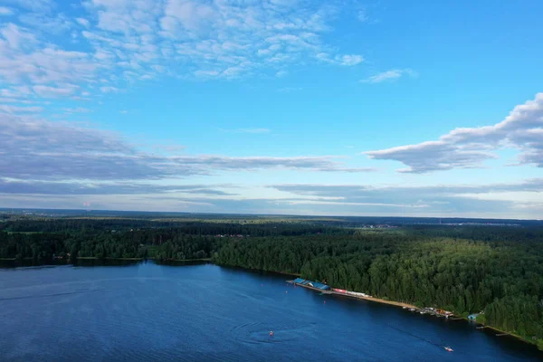 panoramic view of the river with floating boats and beautiful clouds shot from a dronedefault