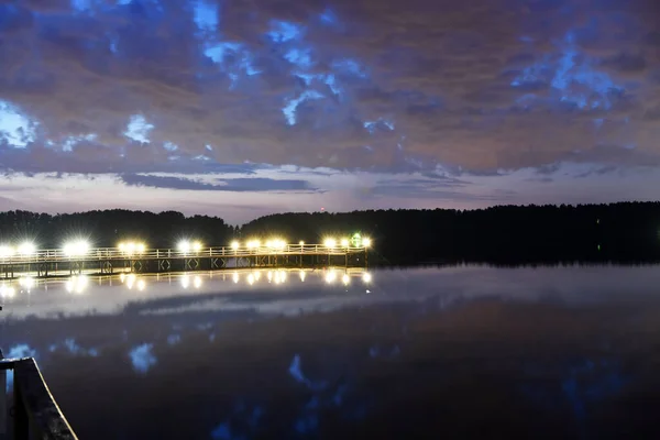 fantastic clouds reflected in the river at sunrise